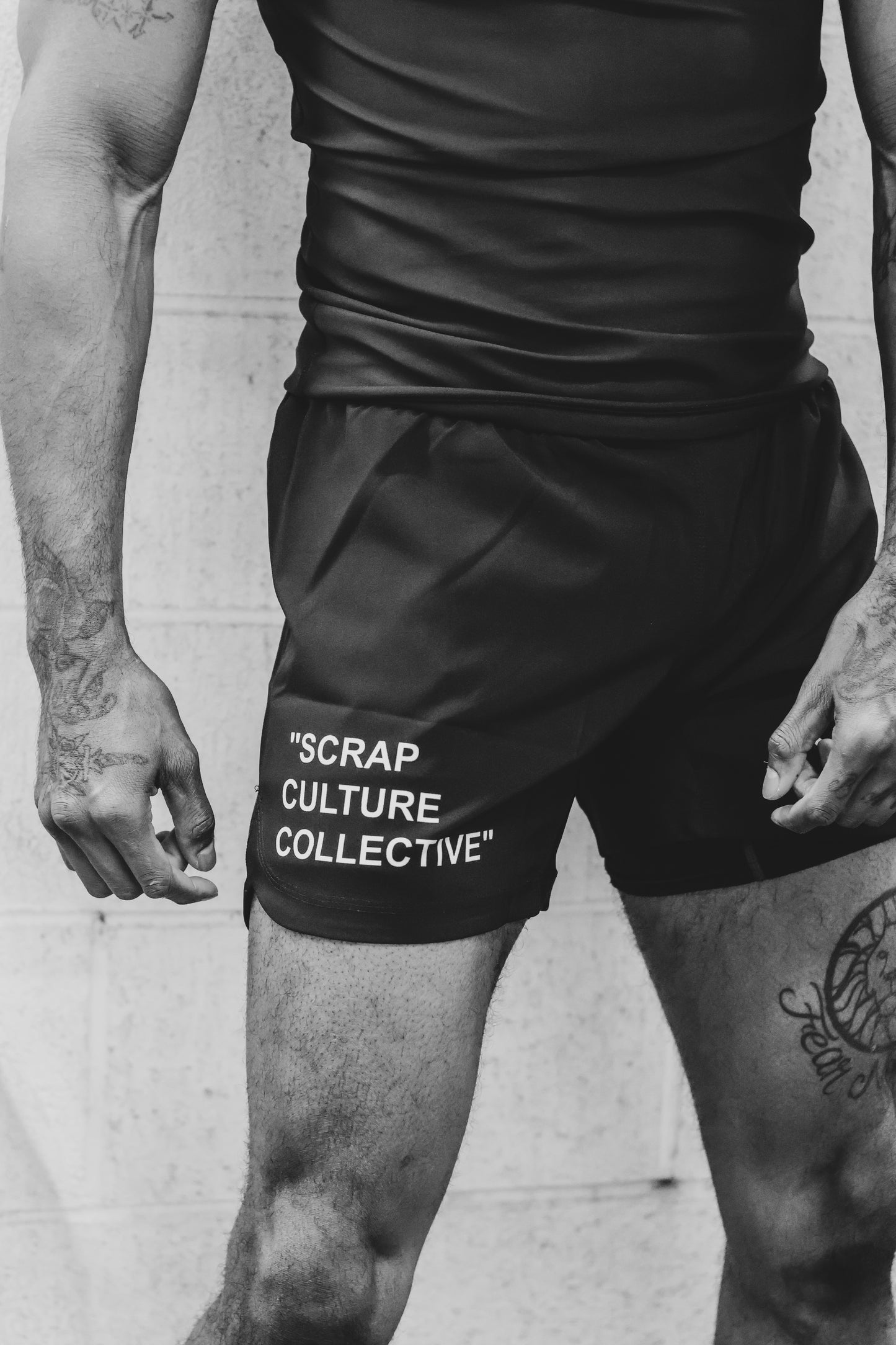 BJJ athlete wearing Garde Collective OG grappling shorts at the gym.