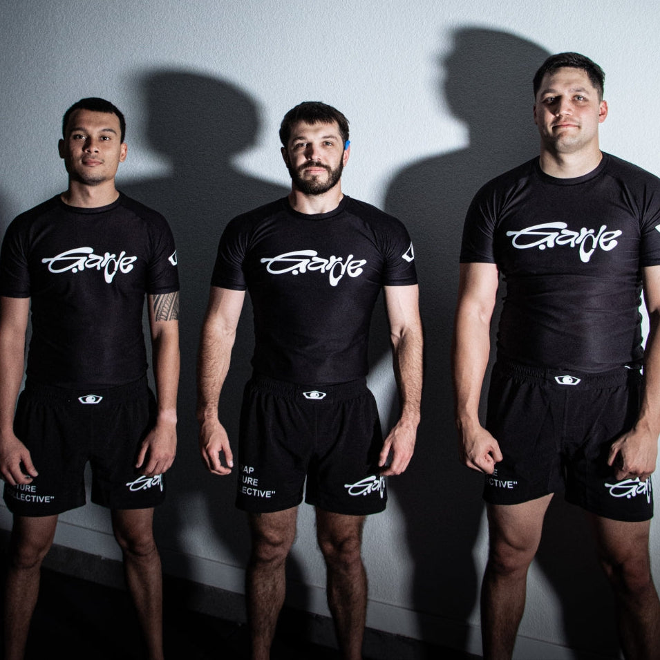 BJJ athletes wearing Garde Collective OG collection jiu jitsu kits at the gym.
