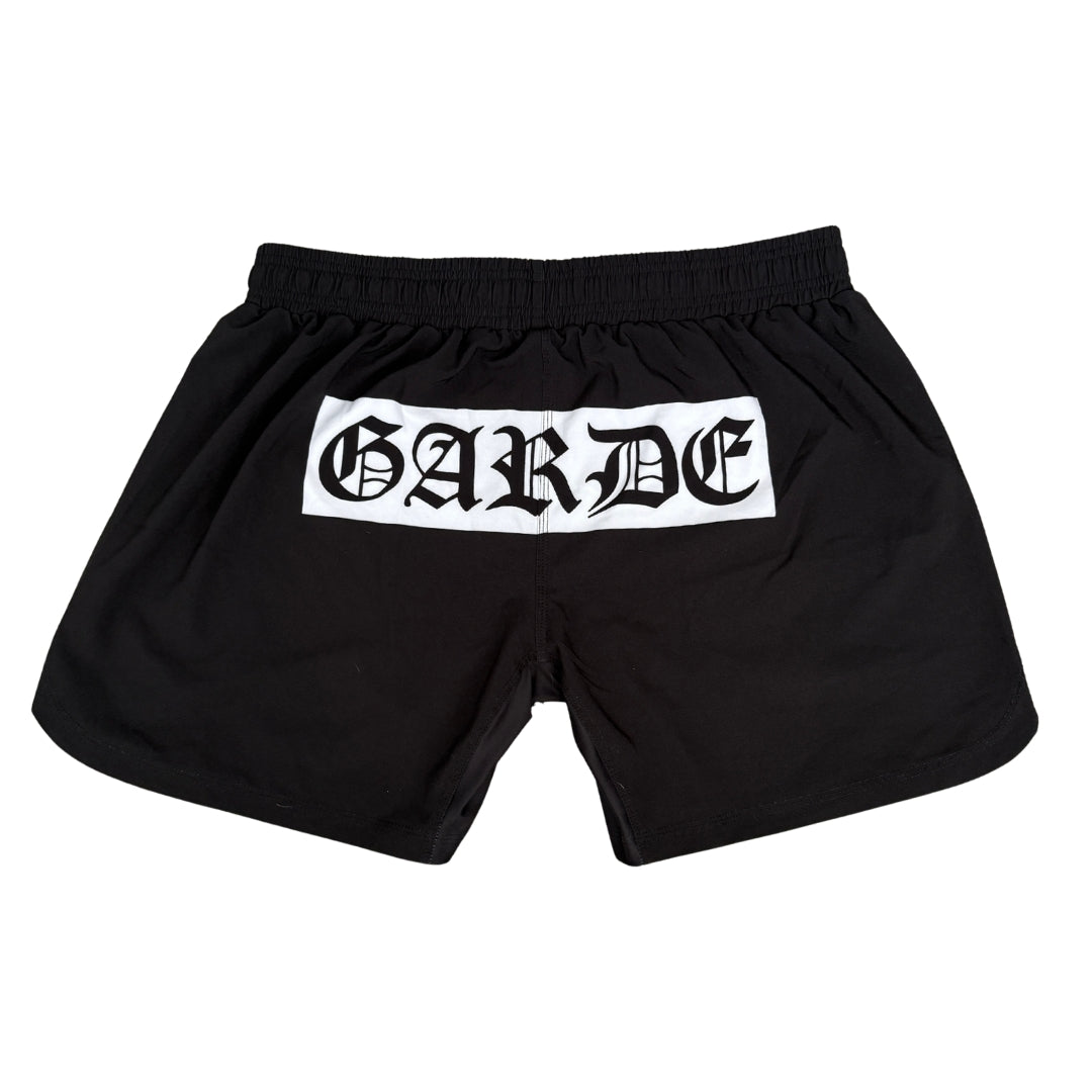 Garde Collective Chaos grappling shorts in black and white.